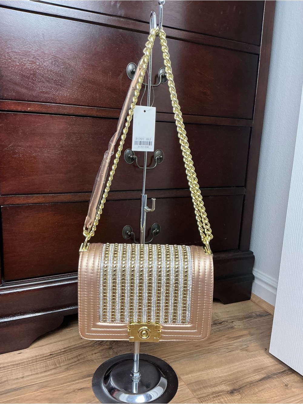 “Glamorous Gold Beaded Evening Bag with Red Lining & Versatile Strap.”